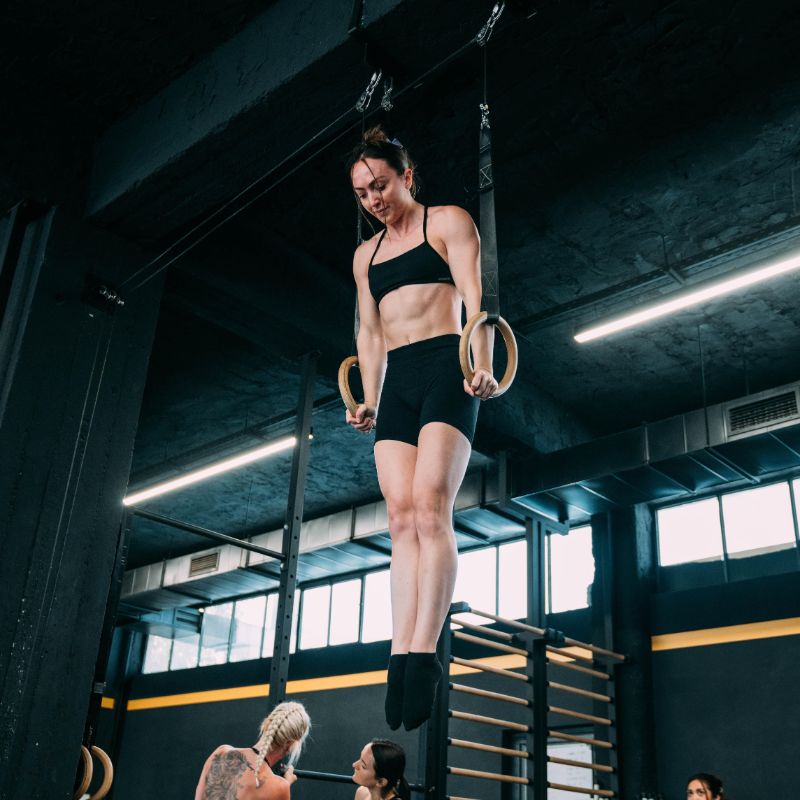 Abbey Willis training on rings in the gym