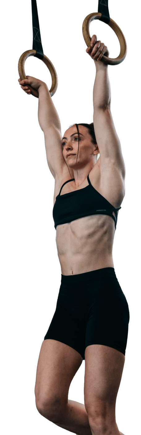 Abbey Willis hanging from gymnastic rings
